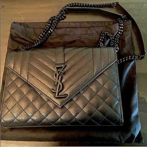 Yves Saint Laurent black purse in excellent condition.